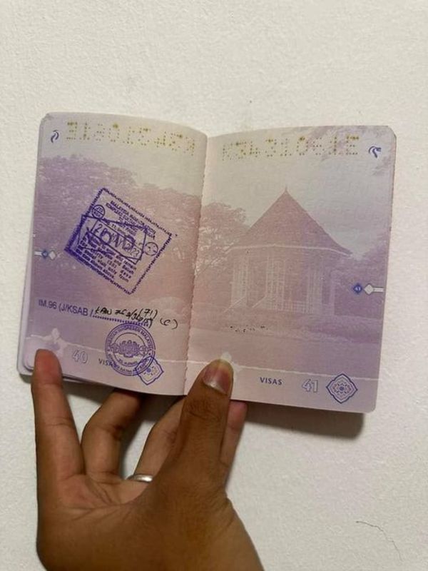 The couple shared a photo of their passport pages as stamped by the officer.