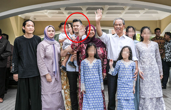 Fakhri (circled in red) with his father Muhyiddin after the latter was appointed the eighth prime minister on 29 February 2020.