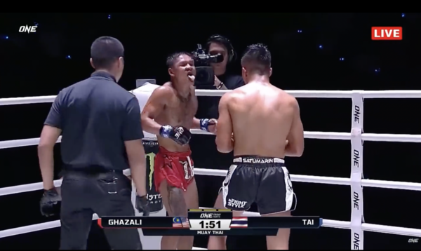 Johan's Thai opponent sticking his tongue out during the match.