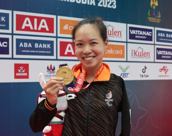 Lim Carmen, a Malaysian gold medalist swimmer in women's 50m breaststroke.