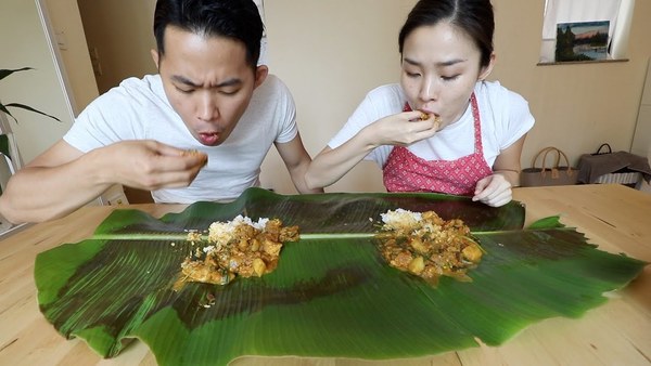 iChang and Jimmy eating their homemade curry chicken on a banana leaf when they were living in Hong Kong.