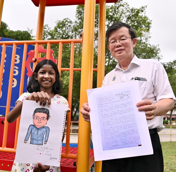 Penang MB Chow Kon Yeow (right) and 10-year-old K Joanna Kristina (left).