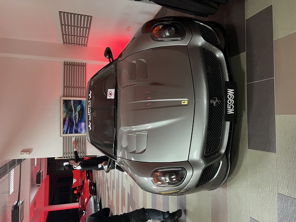 A Ferrari 599 GTO sits silently by the corner. The car was awoken from its slumber to bless us with a deafening blast from its monstrous V12 engine.