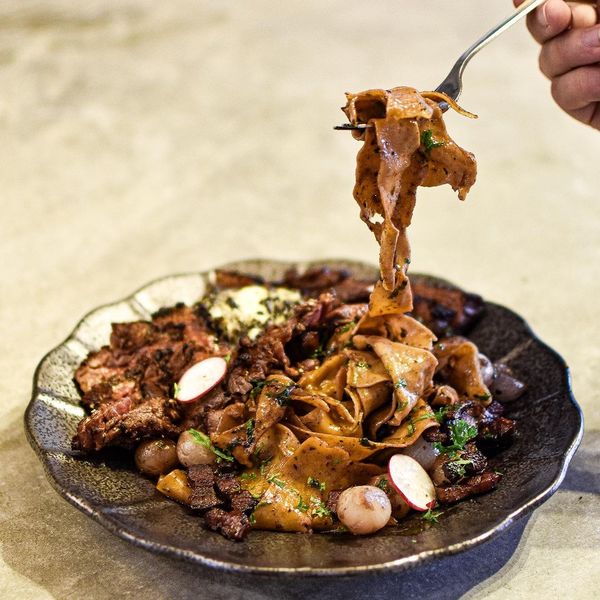 Angus flank steak with bacon, pearl shallots, and a red wine reduction, paired with silky smooth sheets of black pepper-crusted pappardelle.