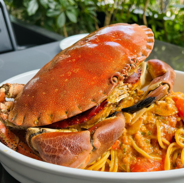 Homemade Pasta, Fresh Tomato Sauce, Bisque and Whole Crab.