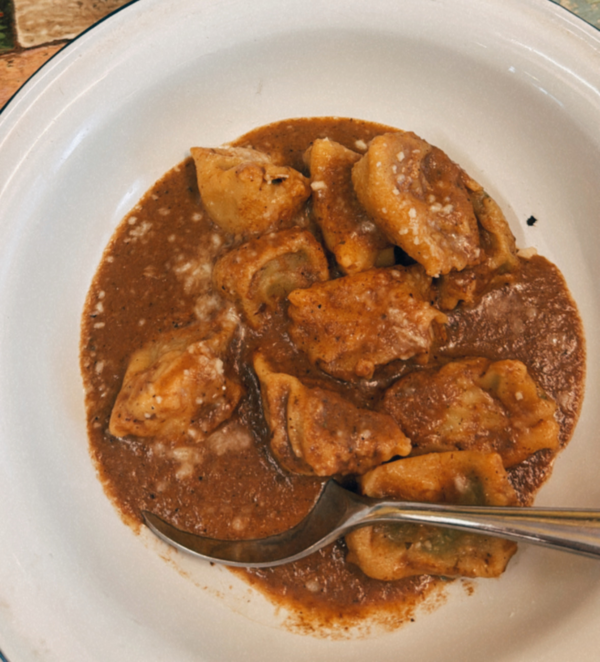 Ravioli Del "Plin" – Handmade Ravioli stuffed with Ricotta and Spinach in a Porcini Mushroom Sauce.