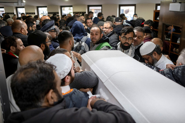 Mourners surround the casket of the victim being carried by his family out of Mosque Foundation, in Bridgeview, Illinois, US.