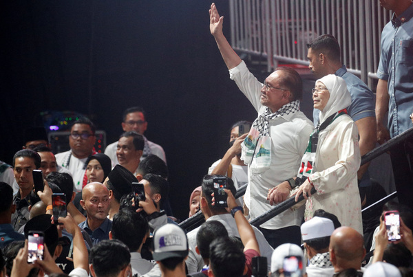 Prime Minister Datuk Seri Anwar Ibrahim gestures during a solidarity gathering to show support for Palestinians, amid escalating conflict between Israel and Hamas, in Kuala Lumpur.