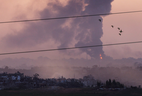 Smoke rises over Gaza, as seen from Israel's border with Gaza, in southern Israel, 29 October.