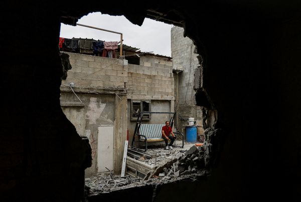 A Palestinian man reacts to the damage after Israeli troops demolished their house.