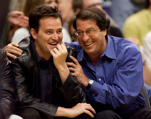 Matthew Perry and studio executive Peter Roth attend Game One of the NBA Finals at Staples Center in Los Angeles, 7 June 2000.