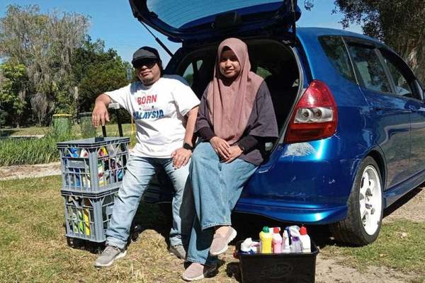 Farasafina Md Daud and her husband.