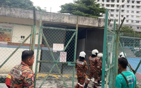 A fire and rescue team inspecting the TNB power substation in Taman Sri Bayu, Bayan Lepas, Penang yesterday, 16 November.