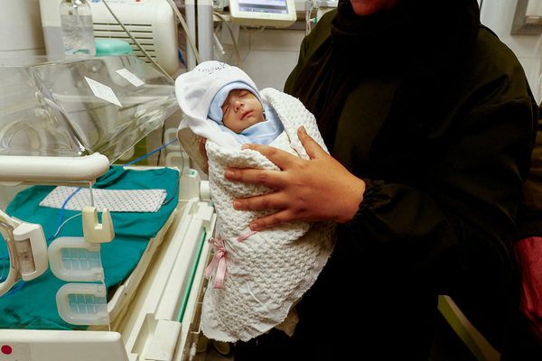 The Palestinian mother holds her newborn Anas Sbeta.