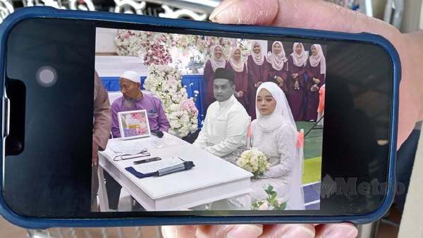 A photo of the couple during their wedding ceremony.