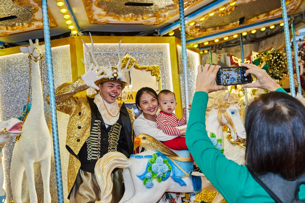 A merry-go-round ride can be found at the concourse of the shopping mall.