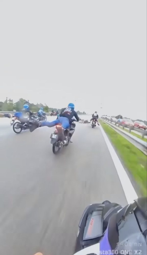 A screenshot taken from the viral video, capturing the riders engaging in reckless riding on the East Coast Expressway.