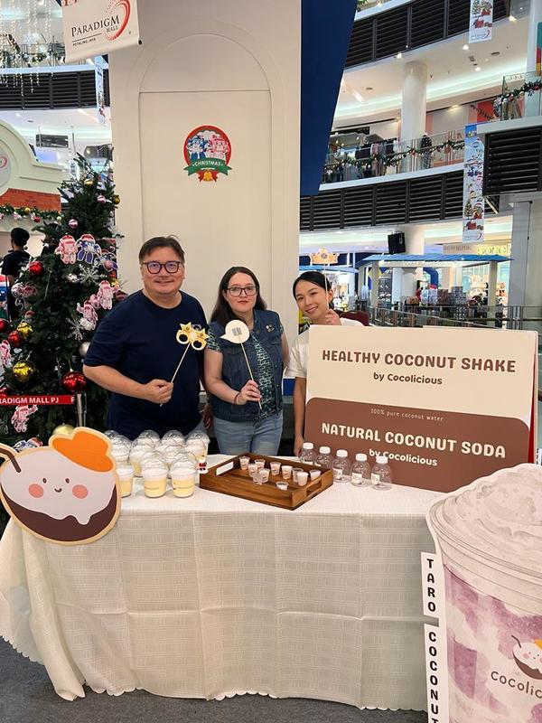 Adrian Ung, Desiree Kaur, and Joekee (Co-founder of Cocolicious) at the Cocolicious booth during the Christmas event at Paradigm Mall PJ.