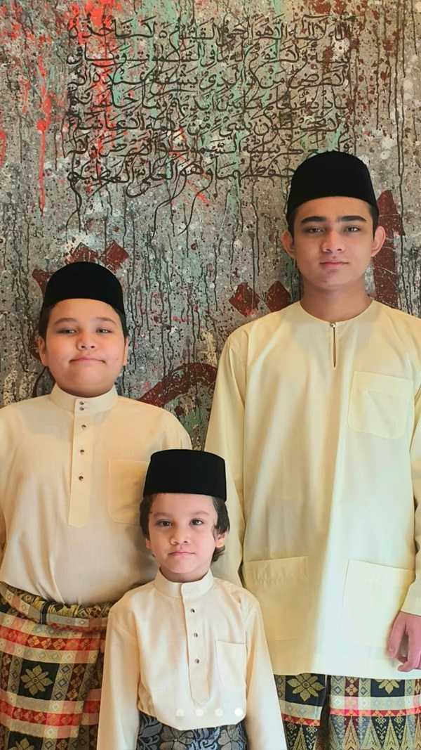 Ian's last Hari Raya photograph with his siblings, Daniel and Emil.