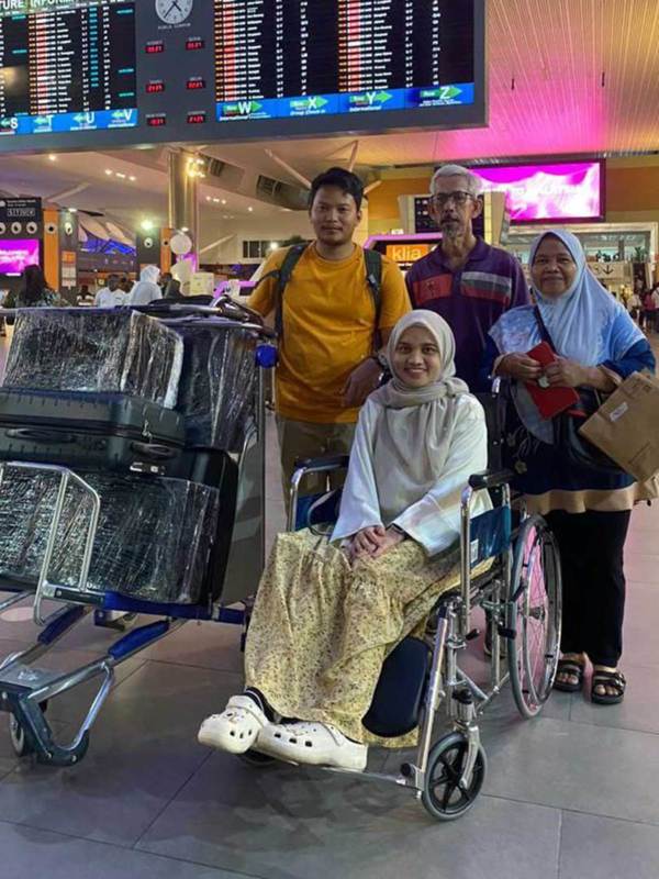 Nadzirah with her husband and parents.