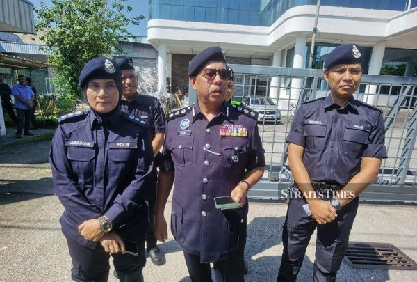 Batu Pahat district police chief ACP Ismail Dollah (middle) speaking to reporters at the entrance of the factory in Johor today.