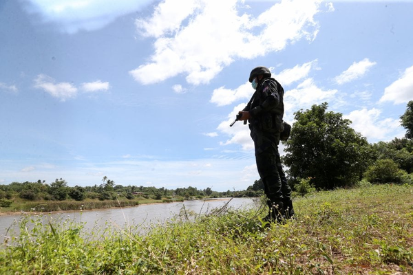 A file image of a General Operations Force officer on duty along Sungai Golok.