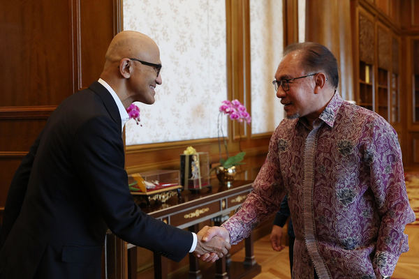 Microsoft CEO Satya Nadella (left) shakes hands with Malaysian Prime Minister Datuk Seri Anwar Ibrahim.