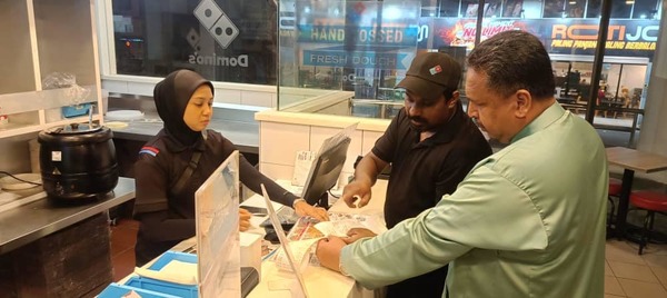 Bayan Lepas assemblyperson Datuk Azrul Mahathir Aziz at the Domino's outlet where the online order was received.