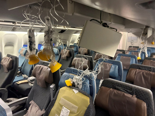 The interior of Singapore Airlines flight SQ321 is pictured after an emergency landing at Bangkok's Suvarnabhumi International Airport, Thailand, 21 May.