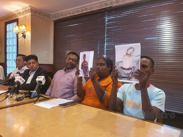 From left: Family lawyer Dinesh Muthal, PEMAS chairman S Dayalan, and the victim's parents, Mogahana Selvi and B Suresh, at the press conference today, 29 May.