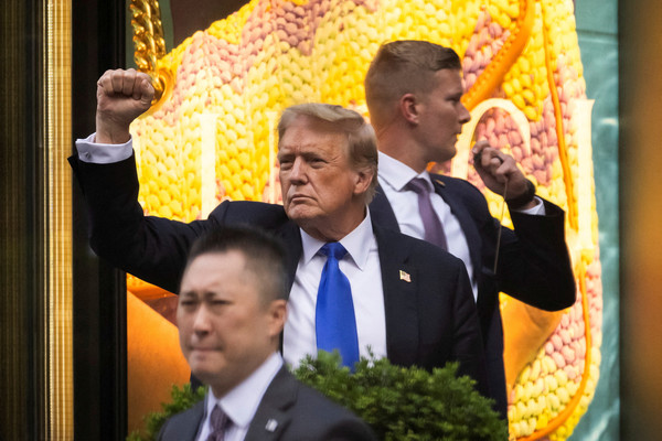 Former US President Donald Trump's gestures following the announcement of the verdict of his criminal trial over charges that he falsified business records to conceal money paid to silence porn star Stormy Daniels in 2016, outside Trump Tower, in New York City, US.