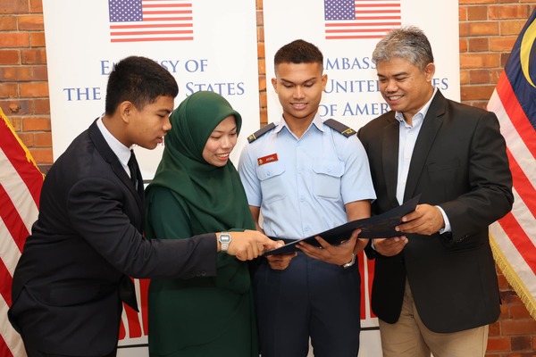 Akmal and his family at the ceremony yesterday, 4 June.