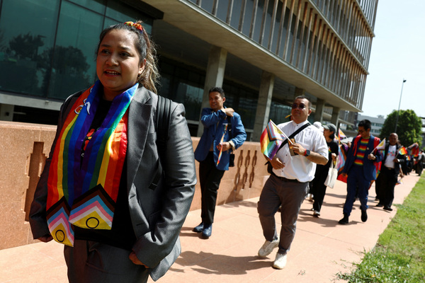 Waaddao Chumaporn, 40, and members of the LGBTQ+ community arrive ahead of the passing of the marriage equality bill in Bangkok, Thailand, on 18 June.