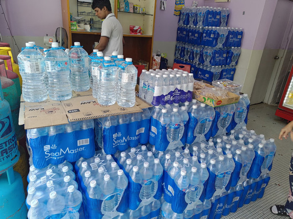 A mini-mart employee in Seputeh said the store ordered a lorry load of bottled water in response to the rising demand.