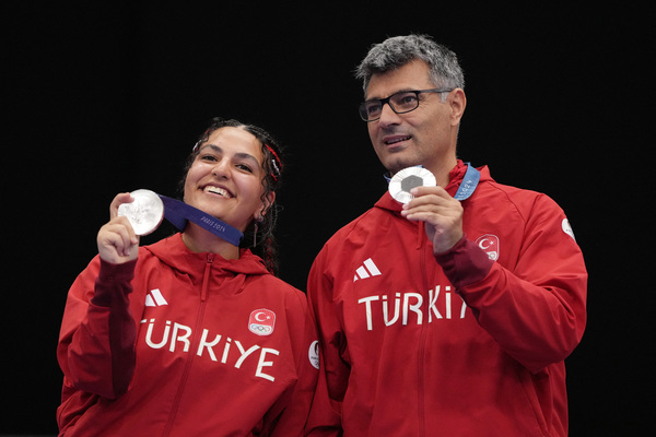 Sevval Ilayda Tarhan and Yusuf Dikec (right) won silver in the 10m air pistol mixed team event on Tuesday, 30 July.