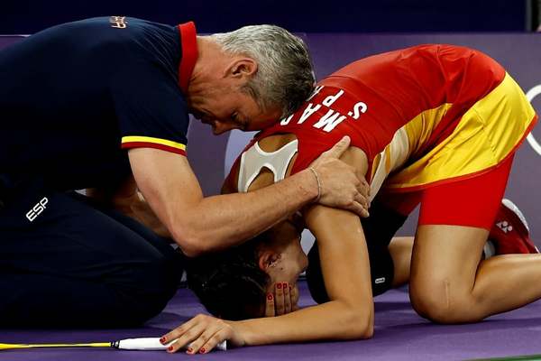 Marin's coach, Fernando Rivas, was seen comforting Marin.