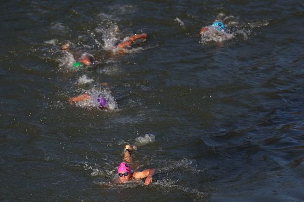 Athletes competing in the swimming race in the Seine, during the mixed relay triathlon on  5 August.