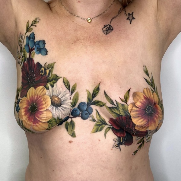 Aside from realistic areola tattoos, incorporating a stunning tattoo design, like this one by Jeniffer Sterry from Paradise Tattoo Studio, to help disguise any scarring can be another option.