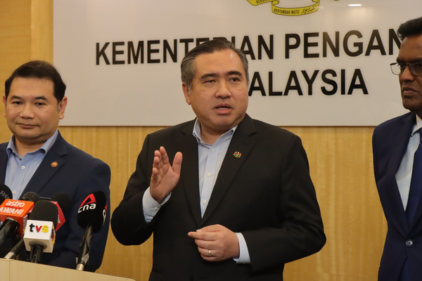 Transport Minister Anthony Loke speaking at a press conference at his ministry today, 14 August.