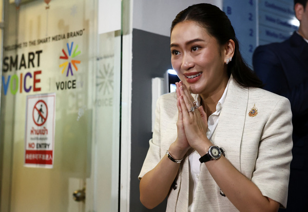 Pheu Thai Party's leader and prime ministerial candidate Paetongtarn Shinawatra gestures on the day of a pivotal parliamentary vote on a new prime minister in Bangkok.