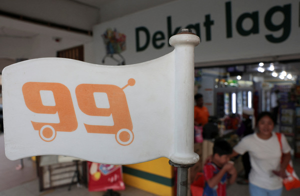 A logo of 99 Speed Mart pictured at one of its mini-markets at Ampang.