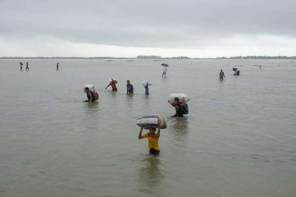 File photo of a Rohingya family arriving at the Bangladesh border from Myanmar.