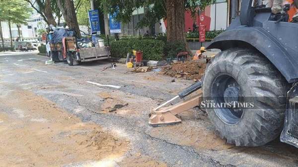 Repair work of the depression in the road is underway.