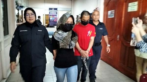 Nurima Juli, the former wife of the e-hailing driver, along with her stepbrother, Sadam Kiram, were charged with his murder at the Tawau High Court today, 24 September.