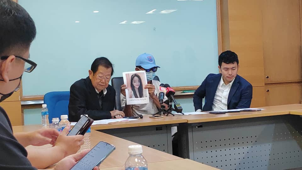 MCA public services and complaints department head Datuk Seri Michael Chong (left) and the victim (middle) holding a profile photo used by the fraudster.