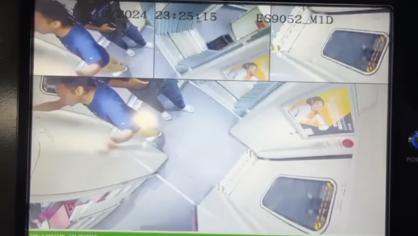 A screenshot of the man pulling the emergency brake inside the carriage.