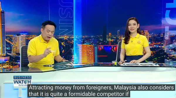 YouTube auto-translation of TNN news anchors discussing Malaysia's success in attracting significant FDI.