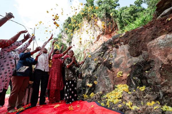 Families of the Gunung Cheroh rockfall victims holding a remembrance ceremony last year.