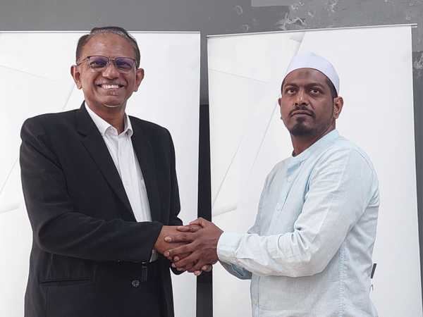 Mohd Razwil Abdullah (right) with his lawyer Habib Rahman Seeni Mohideen.