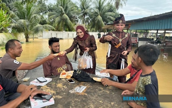 The couple distributed food and gifts from their wedding ceremony.